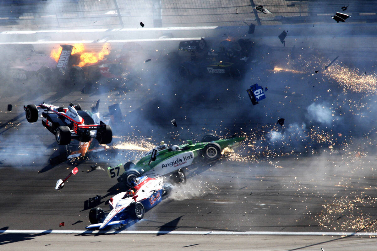 IndyCars slam together in a massive crash during the IZOD IndyCar World Championship at the Las ...