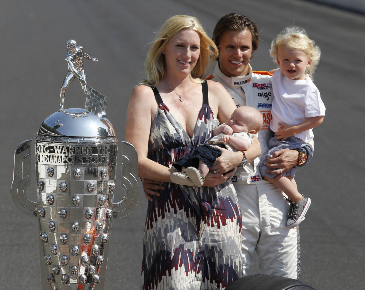 In this May 30, 2011 file photo, IndyCar driver Dan Wheldon, of England, poses with his family, ...