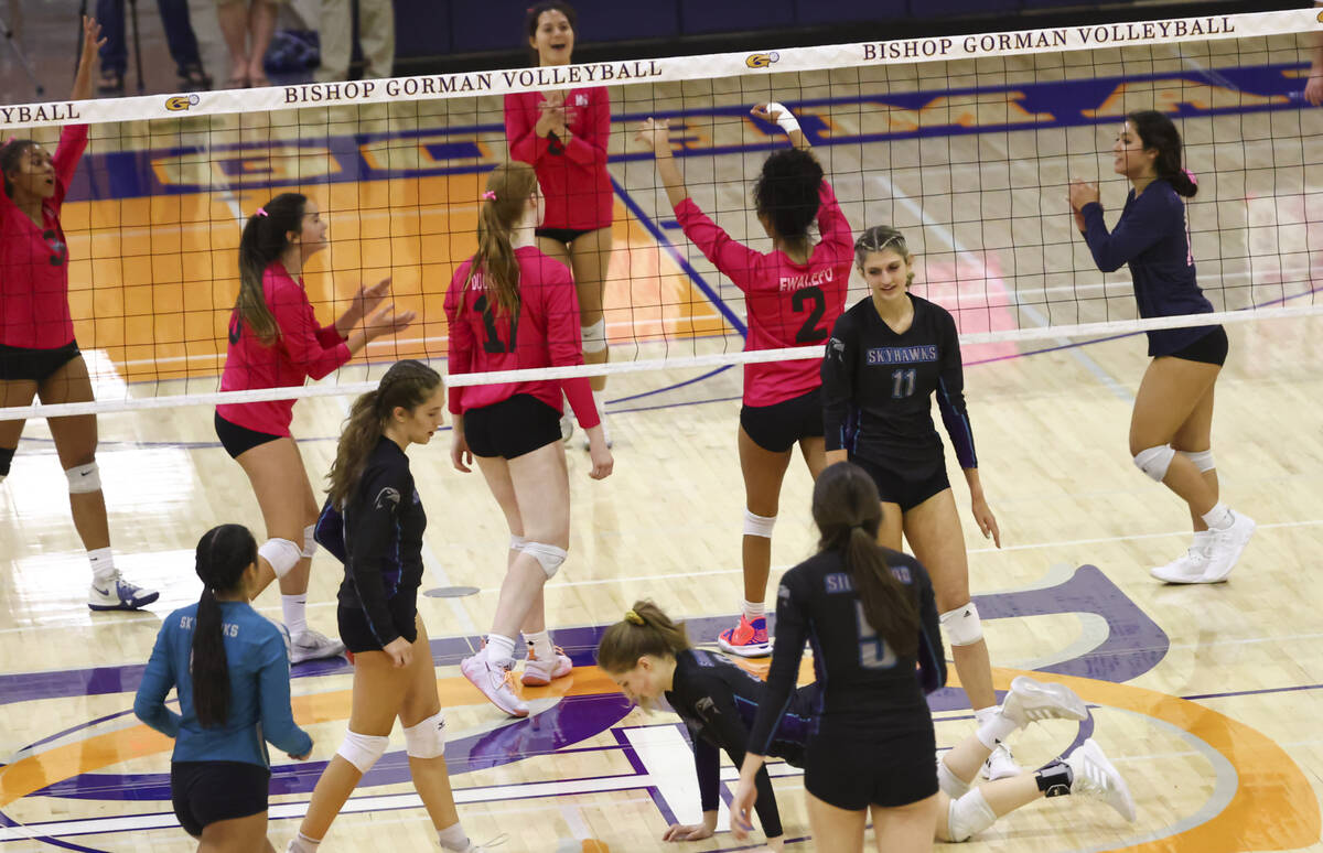 Bishop Gorman players celebrate after a play during a volleyball game at Bishop Gorman High Sch ...