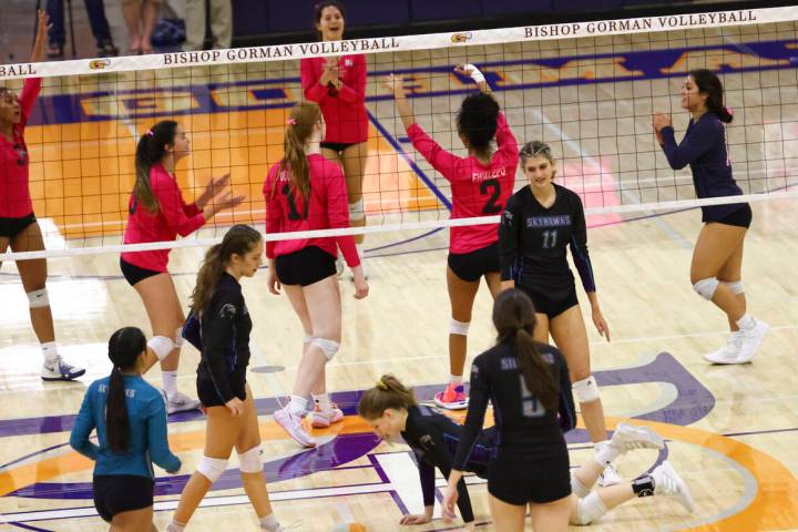 Bishop Gorman players celebrate after a play during a volleyball game at Bishop Gorman High Sch ...