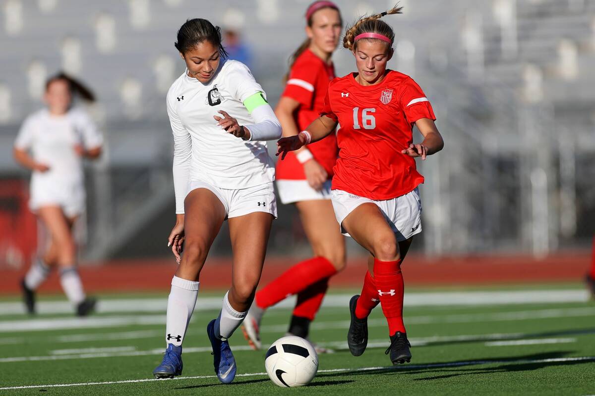 Centennial's Syrena Taylor (13) and Arbor View's Isabella Srodes (16) compete for the ball duri ...