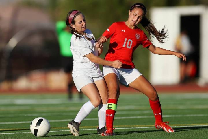 Centennial's Alexandria Neubert (2) loses the ball against Arbor View's Elisa Corvalan (10) dur ...