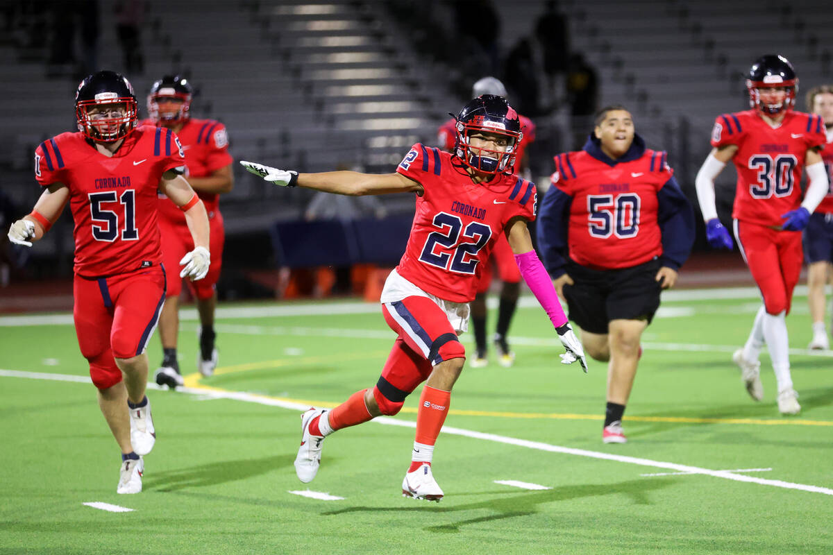 Coronado's Jeremiah Kunitake (22) celebrates his team's win against Shadow Ridge 25-21 in a foo ...
