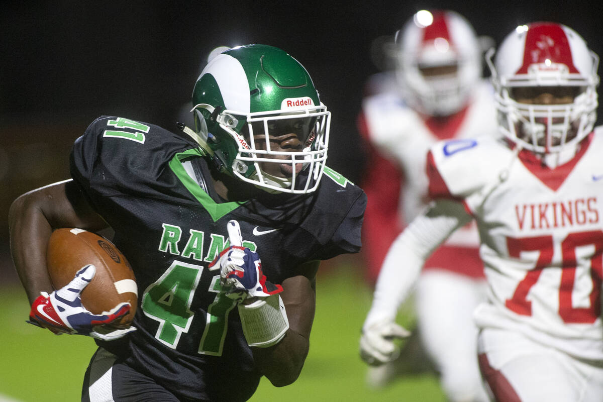Rancho's running back Malik McHugh (41) makes a run for the endzone followed by Valley's offens ...