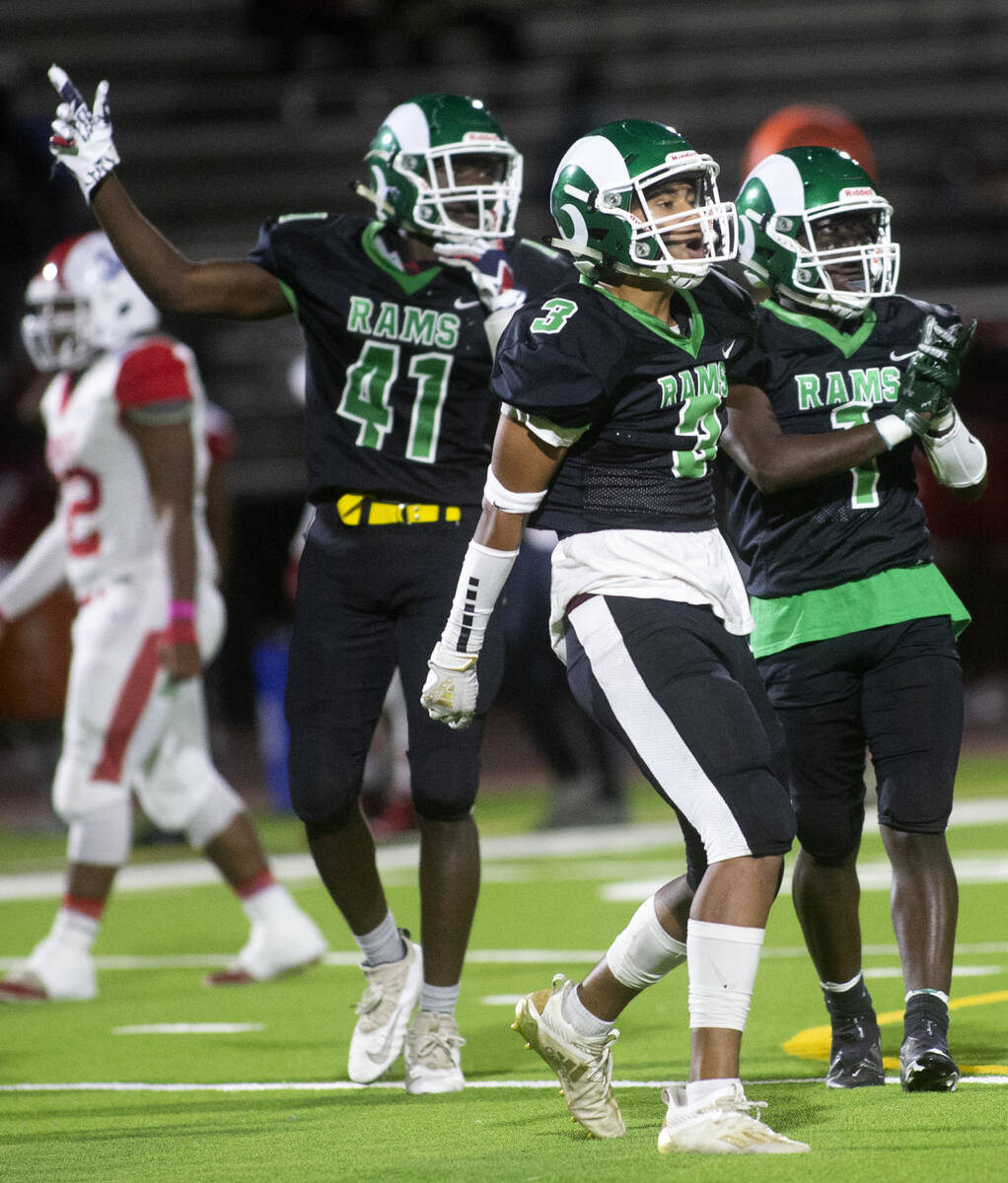 Rancho's Malik McHugh (41), Mason Reams (3) and Crenston Choute (1) celebrate a play during the ...