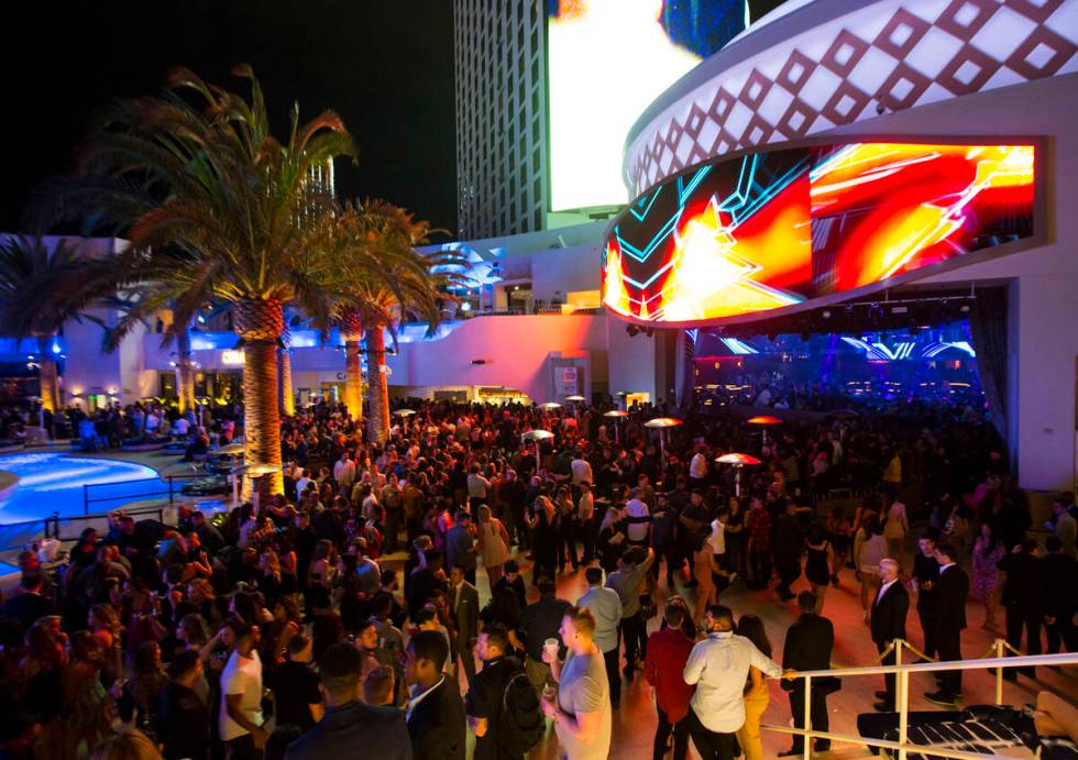 Attendees roam the outdoor area the during the grand opening weekend of Kaos at the Palms in 20 ...