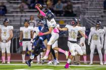 Canyon Springs' Tavian A. McNair (9, left) has a pass knocked away by Foothill's Jason Fisher ( ...