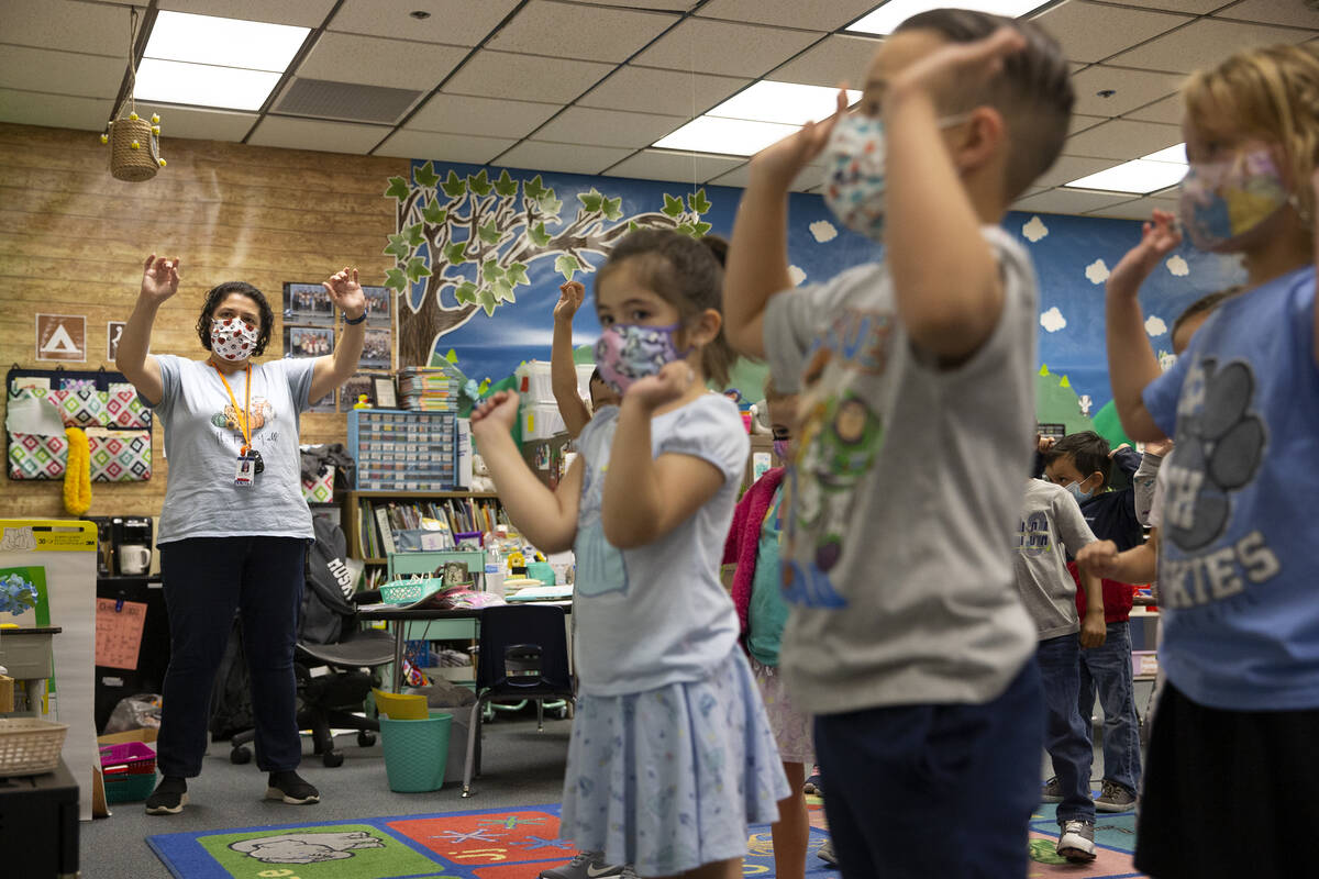 Kindergarten teacher Annabelle Pagliaroli, left, leads her class in an active, verbal alphabet ...