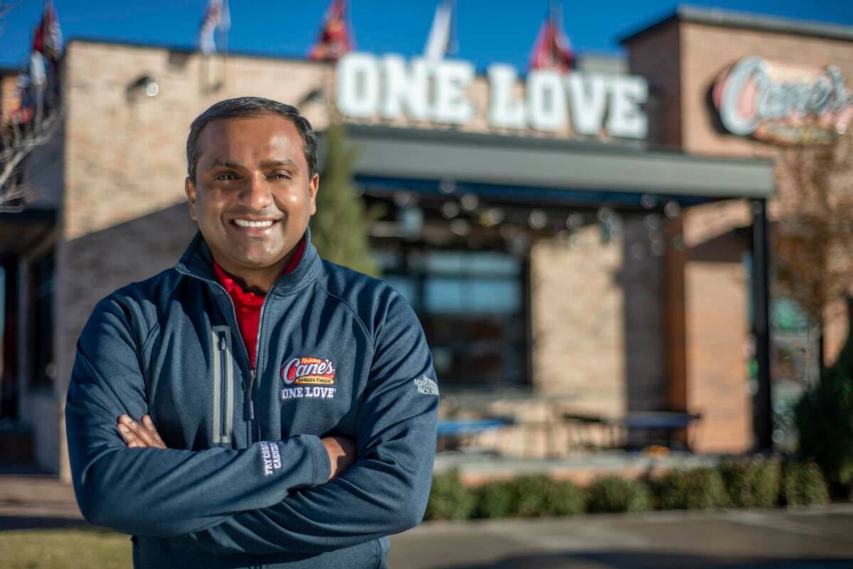 AJ Kumaran, co-CEO and COO, stands outside a Raising Canes restaurant. (Raising Canes)