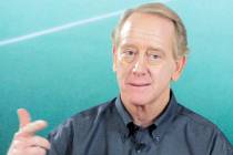 Archie Manning answers questions after the taping of a DirecTV commercial in Beverly Hills, Cal ...