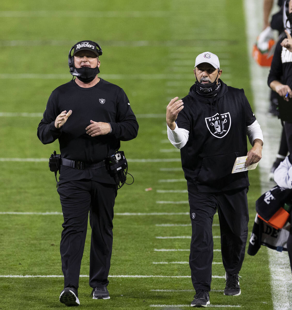 Raiders coach Jon Gruden, left, and assistant head coach and special teams coordinator Rich Bis ...