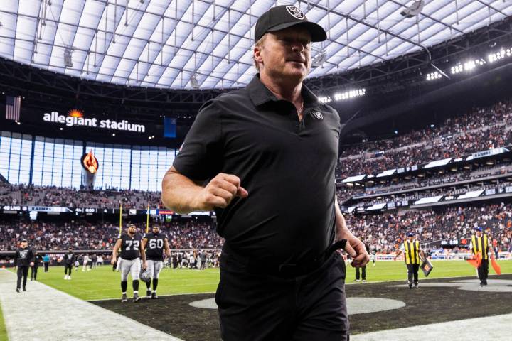 Raiders head coach Jon Gruden jogs off the field after an NFL football game against the Chicago ...