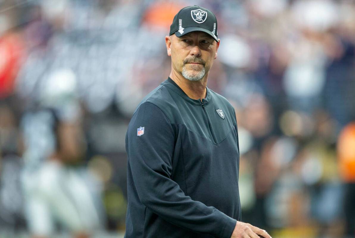 Raiders defensive coordinator Gus Bradley takes the field before an NFL football game between t ...