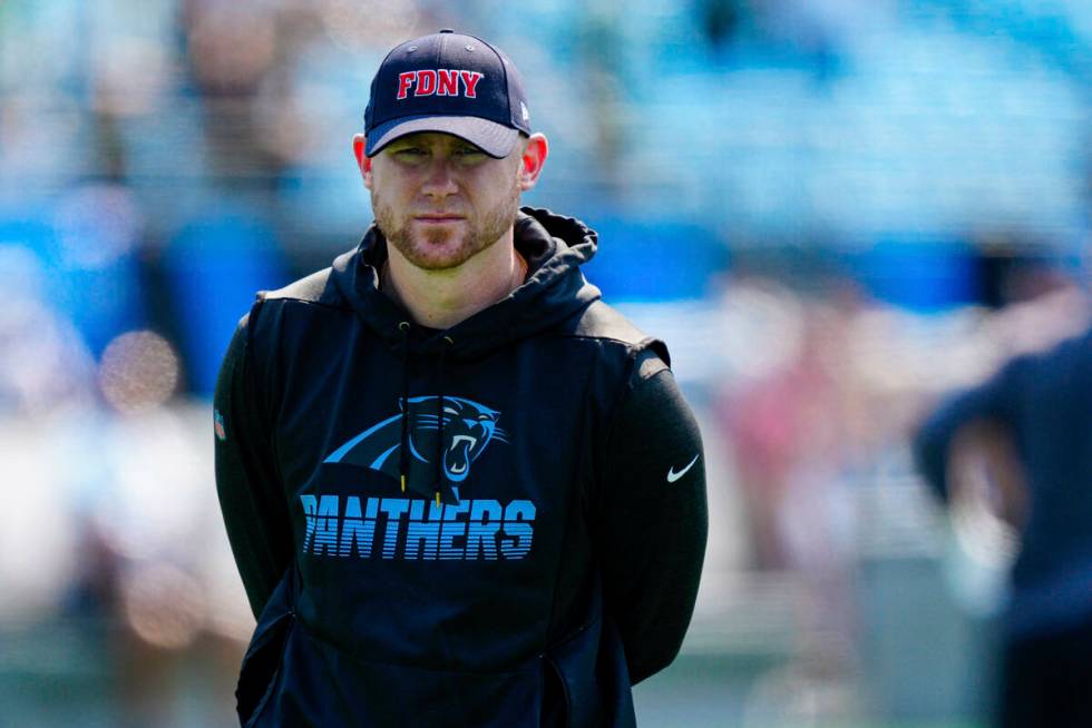 Carolina Panthers offensive coordinator Joe Brady looks on before the first half of an NFL foot ...