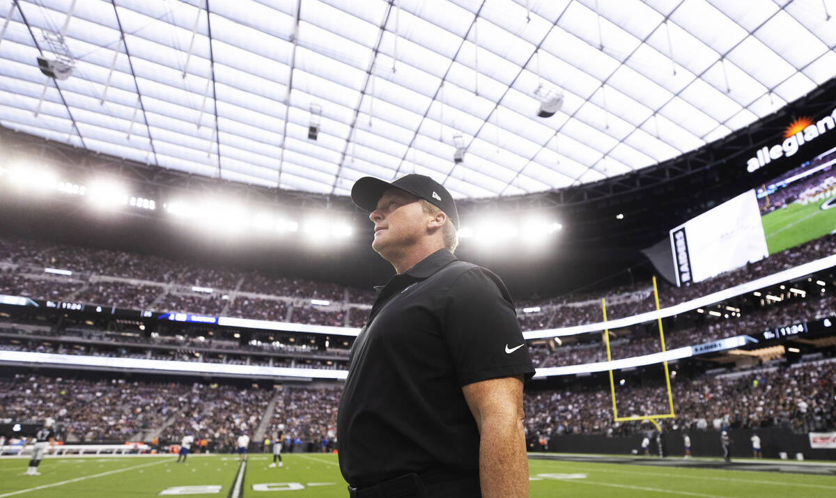Raiders head coach Jon Gruden takes the field during warm ups before the start of an NFL footba ...