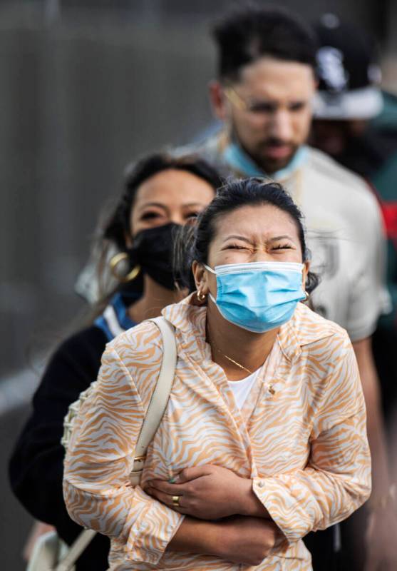 People brave high winds on the Strip on Monday, Oct. 11, 2021, in Las Vegas. (Benjamin Hager/La ...