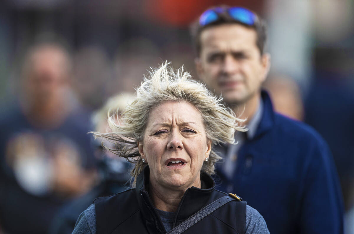 People brave high winds on the Strip on Monday, Oct. 11, 2021, in Las Vegas. (Benjamin Hager/La ...