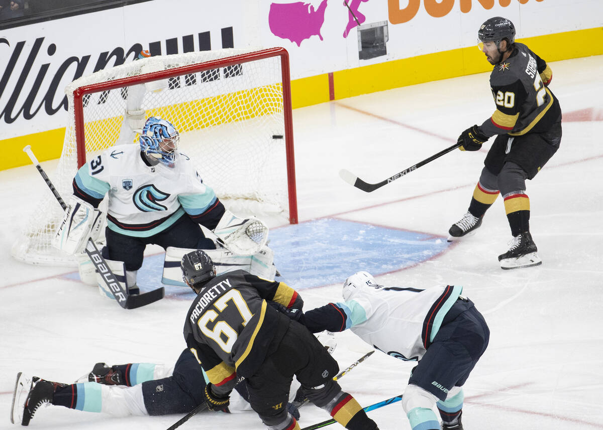 Vegas Golden Knights left wing Max Pacioretty (67) scores against Seattle Kraken goaltender Phi ...