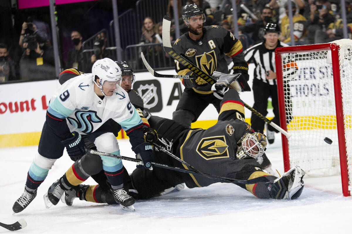 Kraken center Ryan Donato (9) scores a goal on Golden Knights goaltender Robin Lehner (90) as d ...