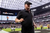 Raiders head coach Jon Gruden jogs off the field after an NFL football game against the Chicago ...