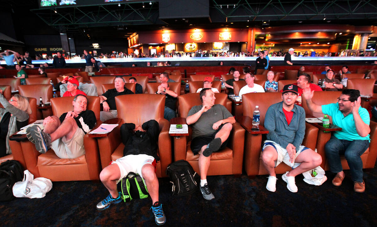 Guests react while watching a basketball game during the NCAA Tournament at the Westgate Superb ...