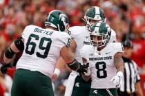 Michigan State wide receiver Jalen Nailor (8) is congratulated by Blake Bueter (69) after scori ...