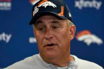 Denver Broncos head coach Vic Fangio meets with reporters following an NFL football game agains ...