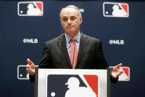 FILE - In this Nov. 21, 2019, file photo, baseball commissioner Rob Manfred speaks to the media ...