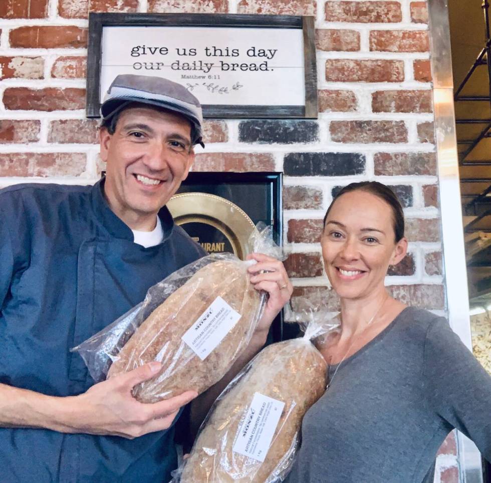 Gio and Naomi Mauro show off bread loaves at Pizzeria Monzu. (Naomi Mauro)
