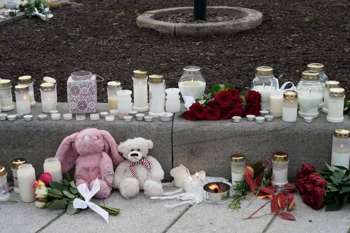 Flowers and candles were left after a man killed several people, in Kongsberg, Norway, Thursday ...