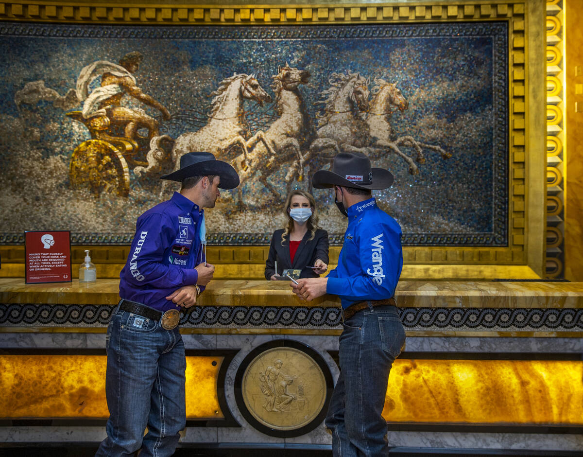 Cowboys Shane Hanchey (left) and Sage Kimzey, right, check in at Caesars Palace to promote the ...