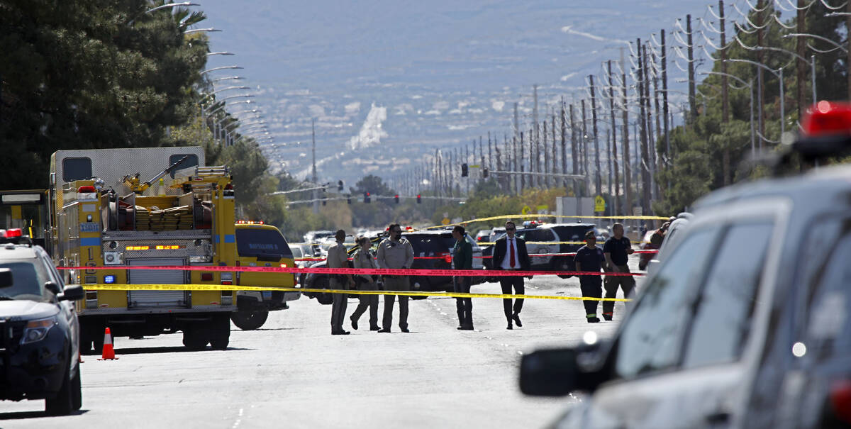 Las Vegas police investigate a police shooting at Charleston Boulevard and Sloan Lane on Tuesda ...