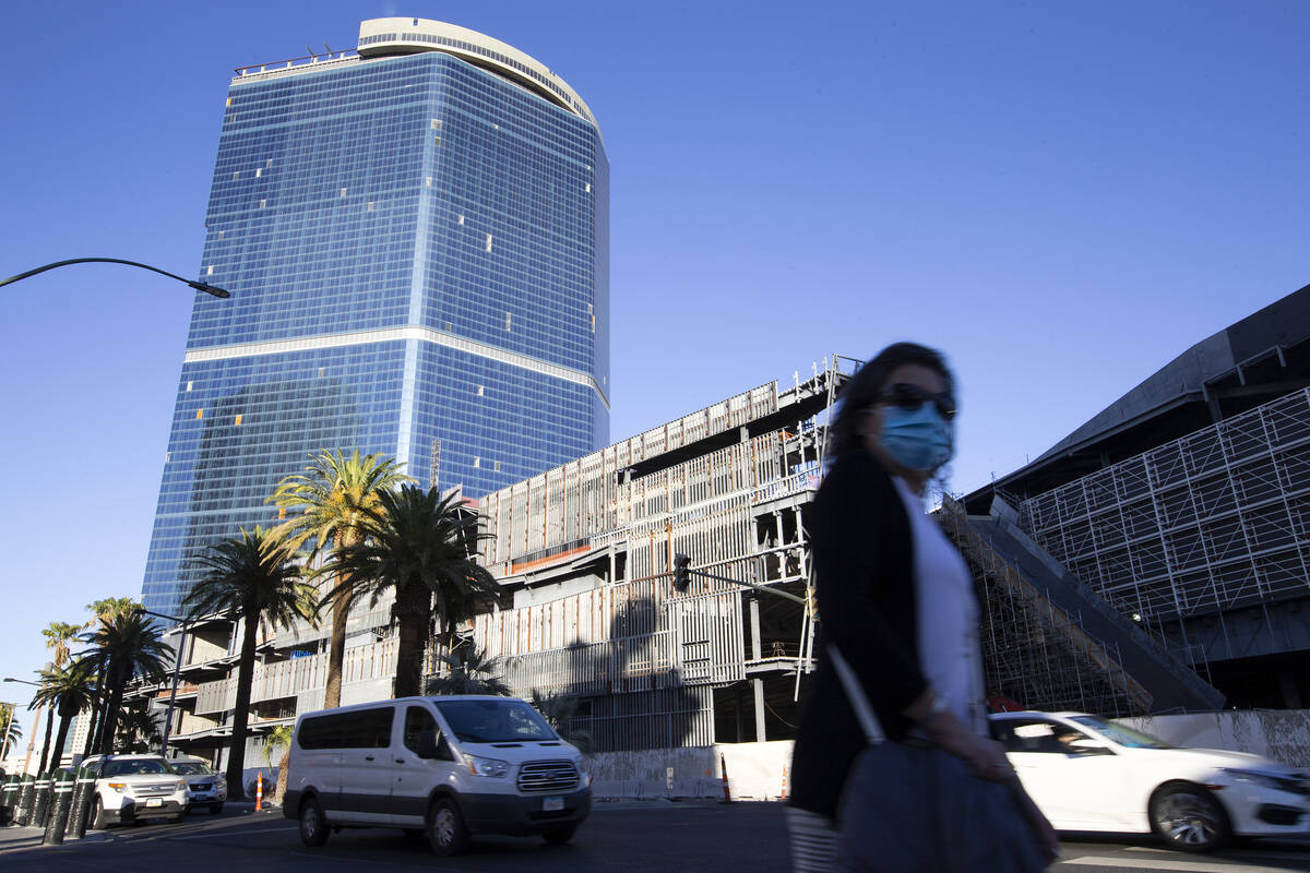 Pedestrians and traffic pass the unfinished former Fontainebleau building on Thursday, Oct. 14, ...