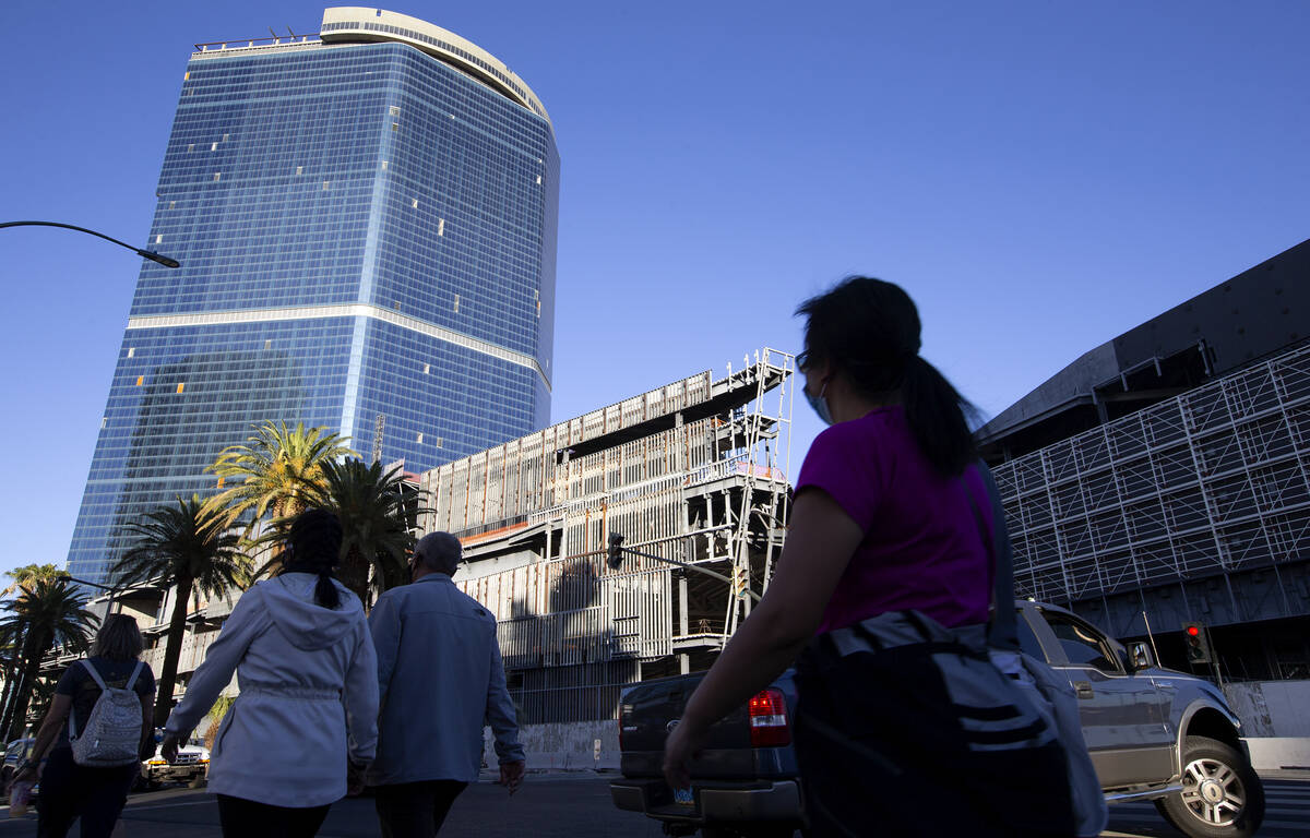 Pedestrians and traffic pass the unfinished former Fontainebleau building on Thursday, Oct. 14, ...