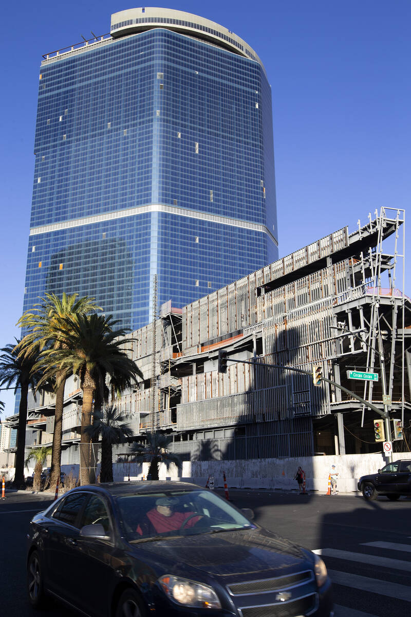 Pedestrians and traffic pass the unfinished former Fontainebleau building on Thursday, Oct. 14, ...