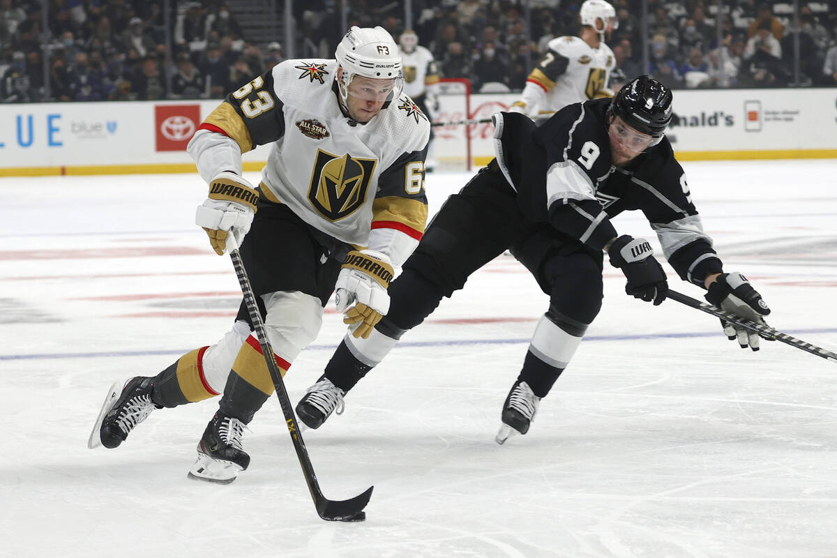 Vegas Golden Knights forward Evgenii Dadonov (63) drives the puck away from Los Angeles Kings f ...