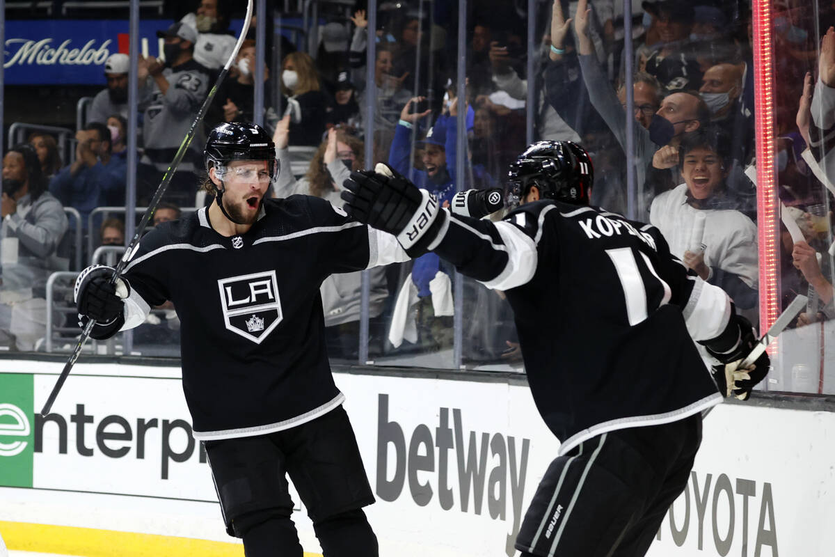 Los Angeles Kings forward Anze Kopitar, right, celebrates his goal with forward Adrian Kempe du ...