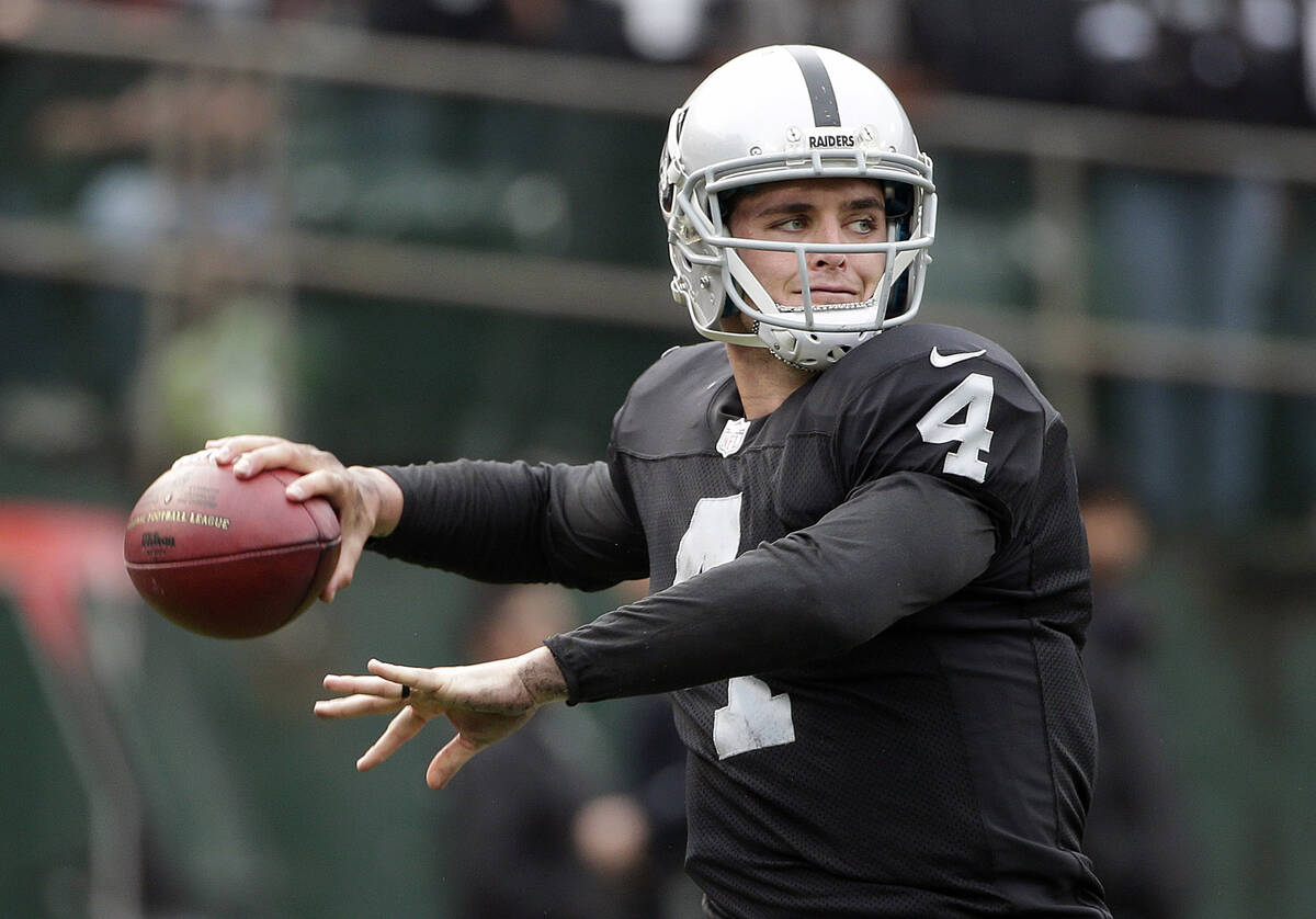 Oakland Raiders quarterback Derek Carr passes against the San Francisco 49ers during the first ...