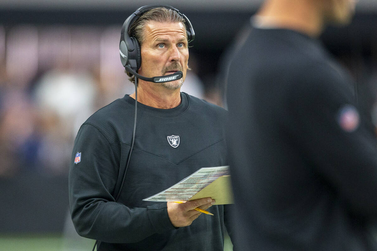 Raiders offensive coordinator Greg Olson coaches from the sideline during the first quarter of ...