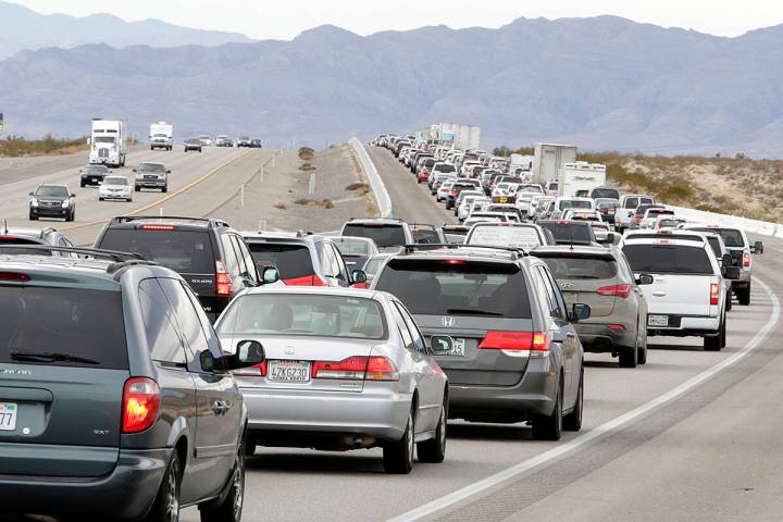 Traffic ibuilds on southbound Interstate 15 near Jean as holiday travelers leave Las Vegas, mos ...