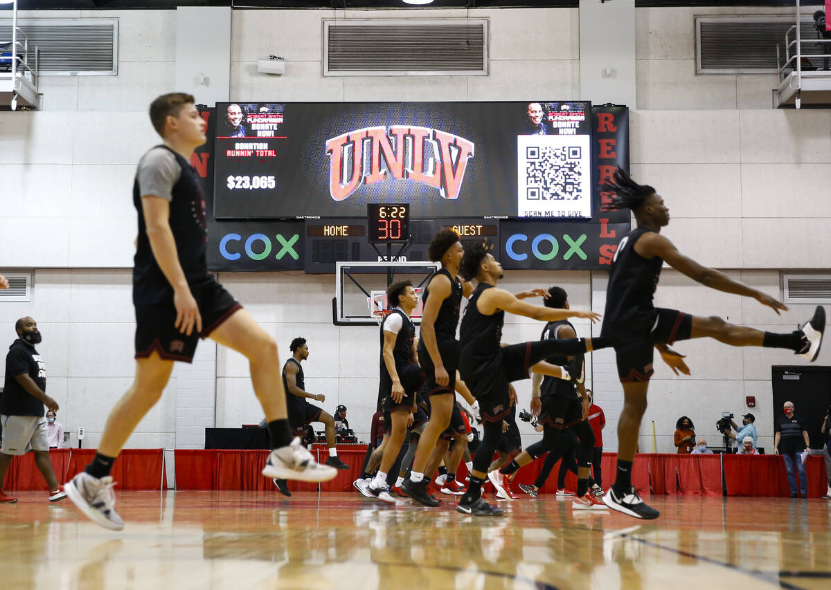 UNLV players warm up during an open basketball practice and fundraiser for former player Robert ...
