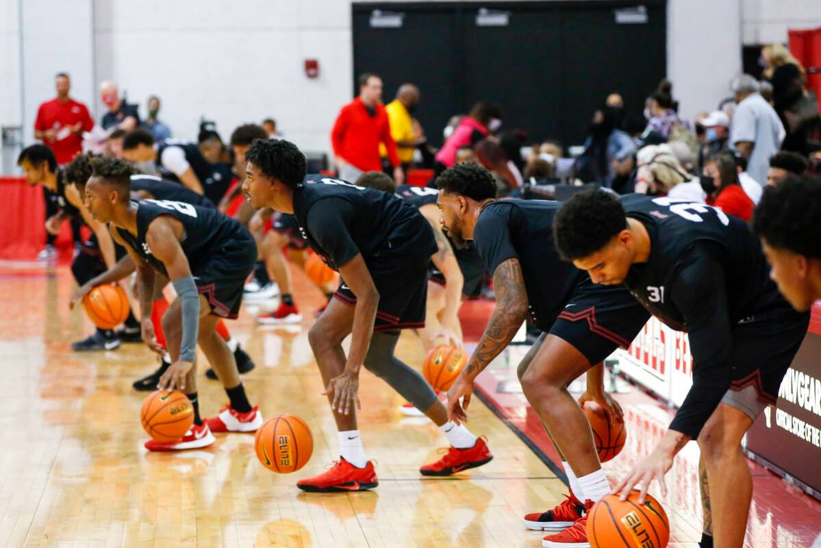 UNLV players warm up during an open basketball practice and fundraiser for former player Robert ...