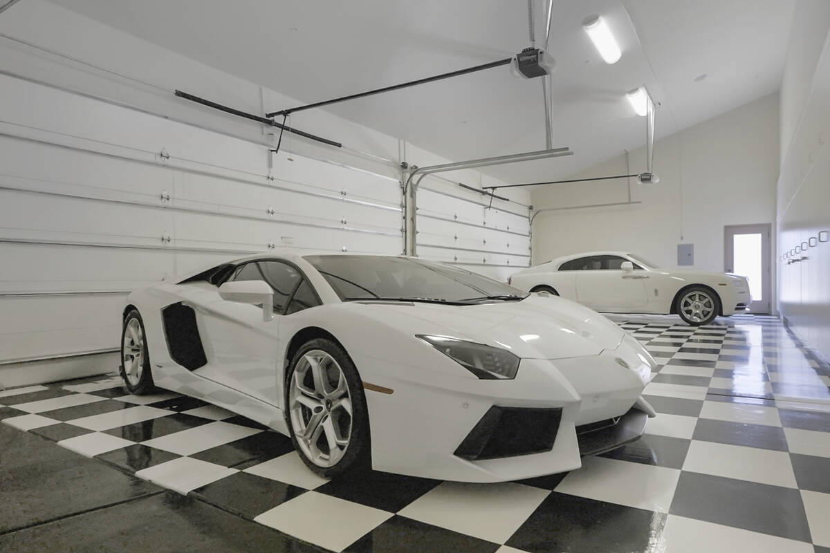 The 15,873-square-foot home has two four-car garages. (Synergy Sotheby’s International Realty)
