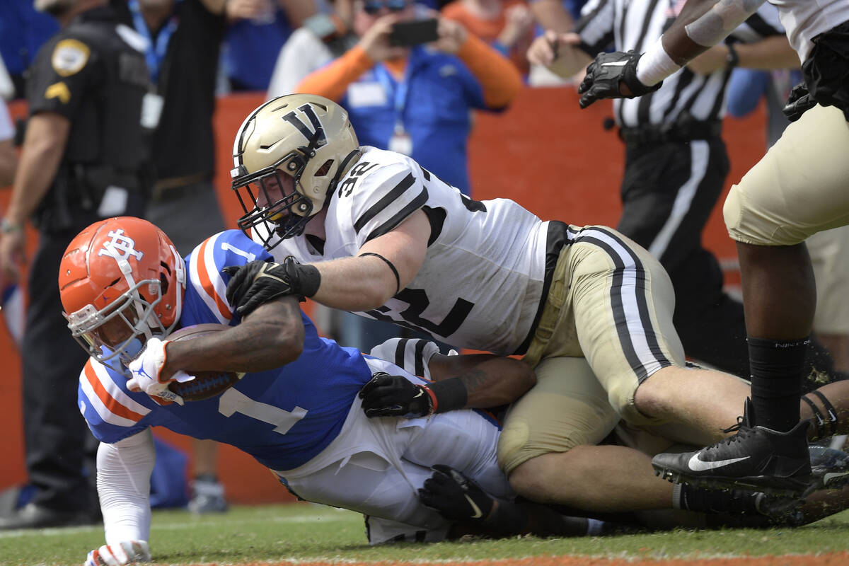 Florida wide receiver Jacob Copeland (1) scores a touchdown in front of Vanderbilt linebacker E ...