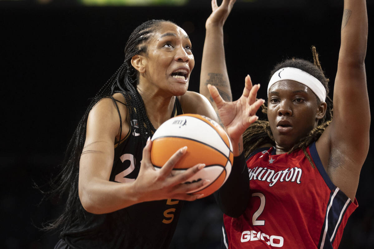 Las Vegas Aces forward A'ja Wilson (22) drives past Washington Mystics forward Myisha Hines-All ...