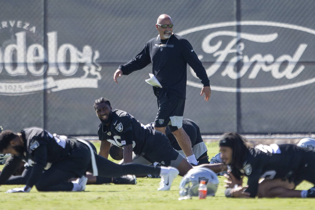 Raiders interim head coach Rich Bisaccia walks the field during a practice session at the Raide ...