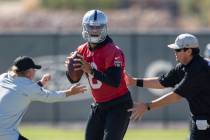 Raiders quarterback Marcus Mariota (8) works through a drill during a practice session at the R ...
