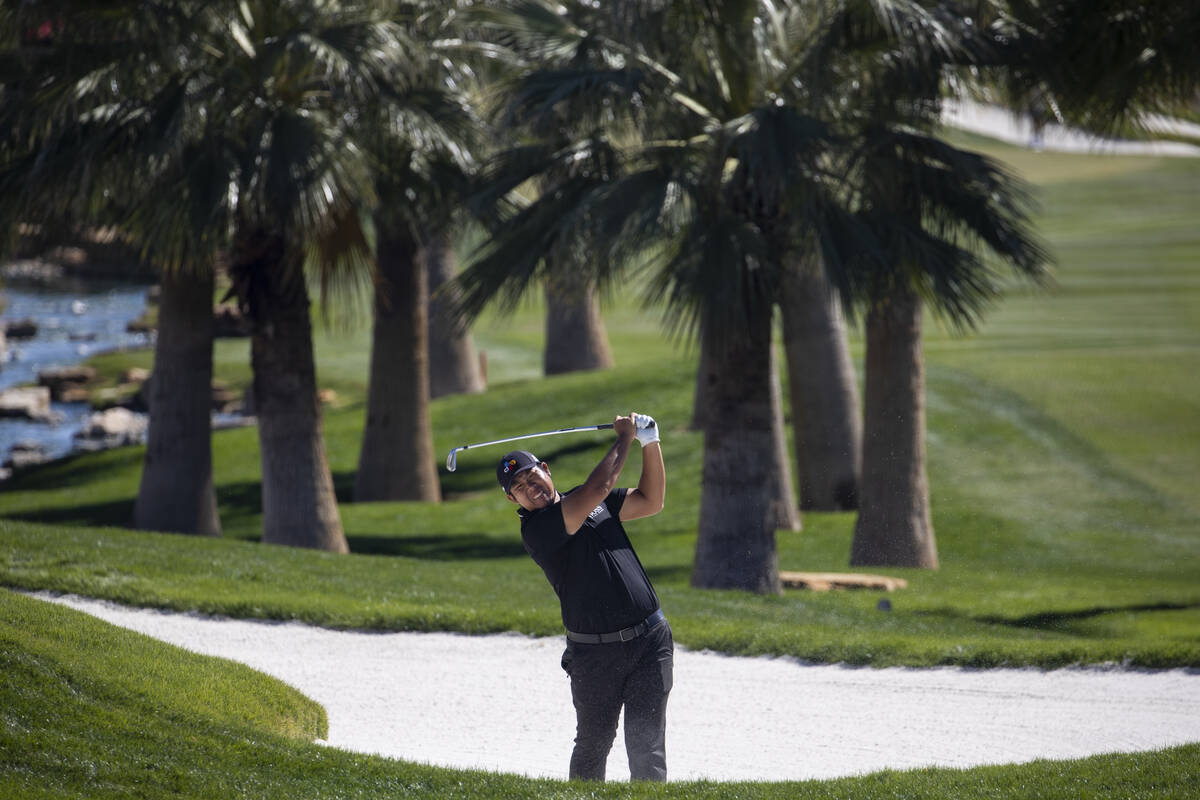 Byeong Hun An hits the ball from the bunker on the 14th hole during the second round of the CJ ...