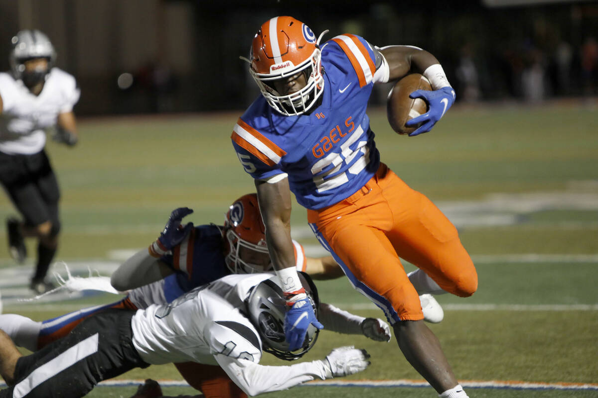 Bishop Gorman High School's William Stallings (25) runs into the end zone for a touchdown passi ...