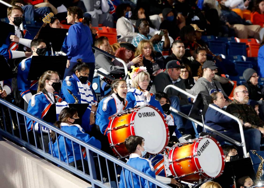 Bishop Gorman High School's marching band cheer during the second half of a football game again ...